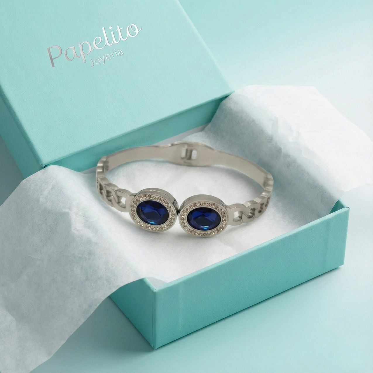 Bracelet rigide avec deux cristaux bleus ovales et zircones - 100 % acier rhodié