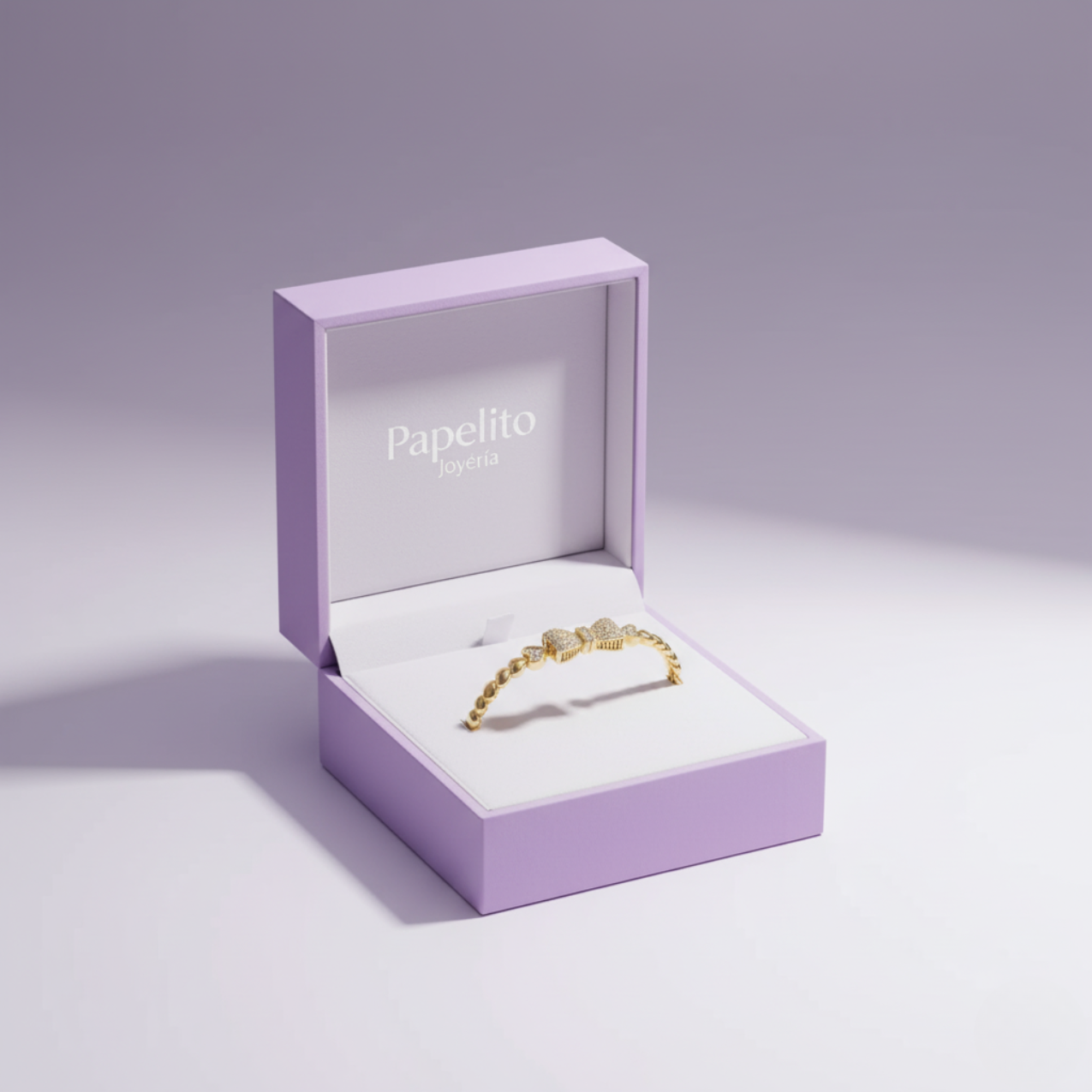 Pulsera de Corazones con Moño de Acero Enchapado en Oro de 18K