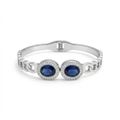 Bracelet rigide avec deux cristaux bleus ovales et zircones - 100 % acier rhodié