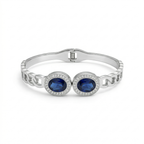 Bracelet rigide avec deux cristaux bleus ovales et zircones - 100 % acier rhodié