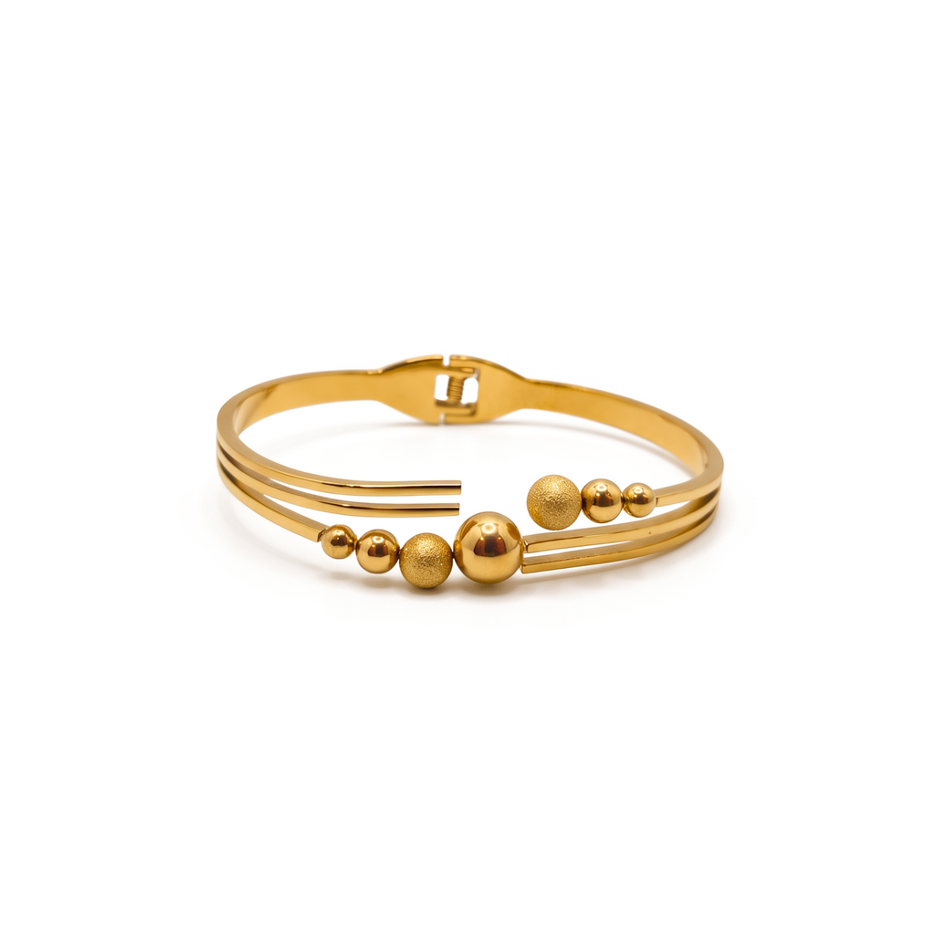 Bracelet rigide ouvert en acier plaqué or 18 carats avec perles lisses et texturées
