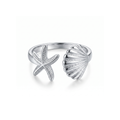 Anillo ajustable de acero con diseño abierto de estrella de mar y concha marina, acabado en plata, fabricado en España por Papelito.