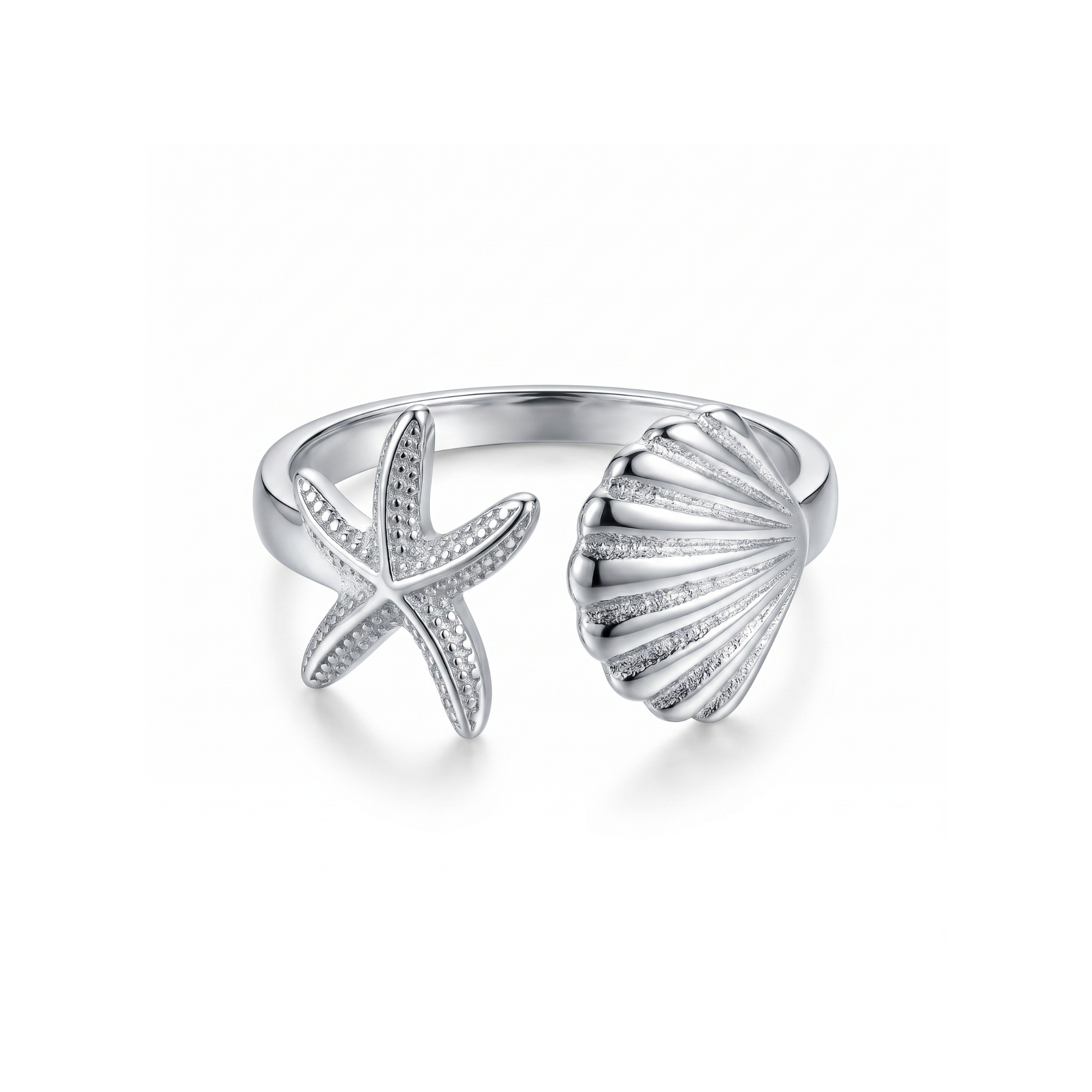 Anillo ajustable de acero con diseño abierto de estrella de mar y concha marina, acabado en plata, fabricado en España por Papelito.