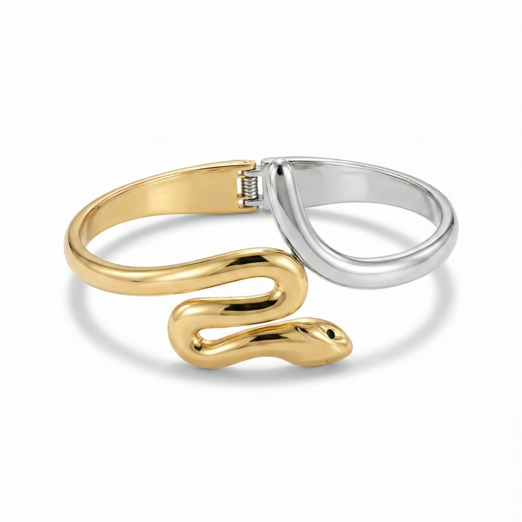 Brazalete rígido de serpiente bicolor en acero con baño de oro de 18K y plata, diseñado y fabricado en España.
