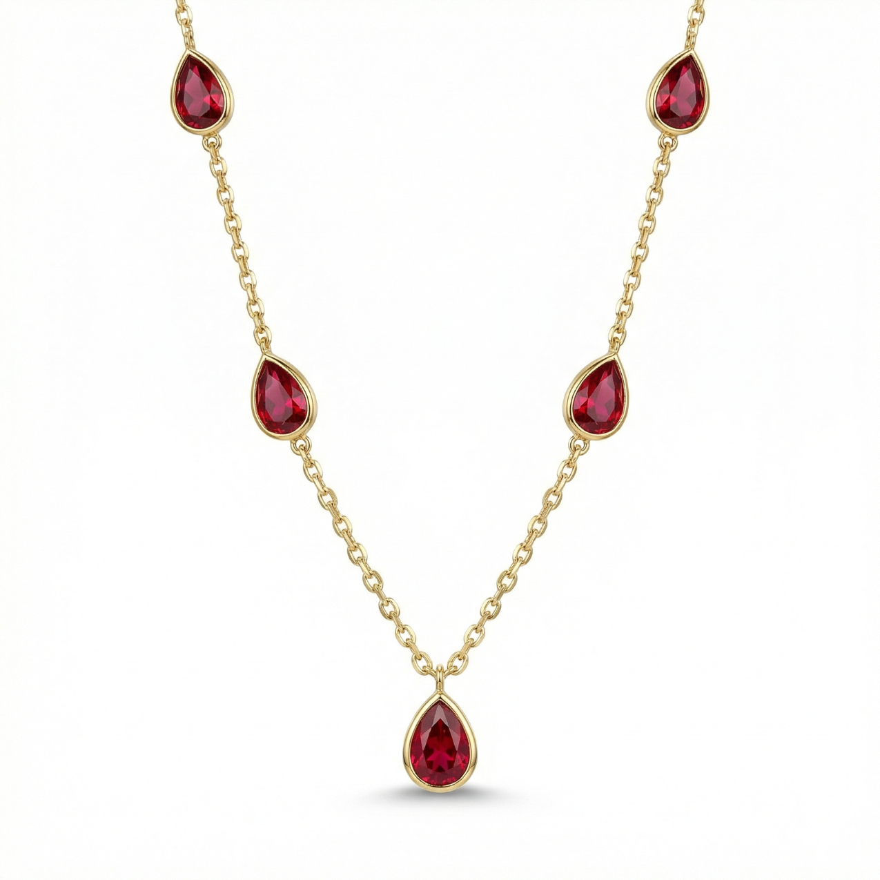 Collar de cadena fina en acero bañado en oro de 18K con cinco piedras rojas en forma de gota, diseñado y fabricado en España.