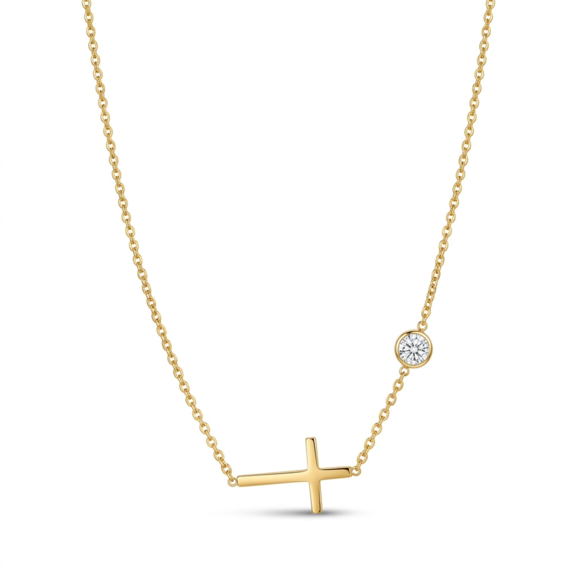 Collar de cadena fina de acero chapado en oro de 18k con un dije de cruz horizontal lateral y un detalle circular de circonita brillante engastada, hecho en España.