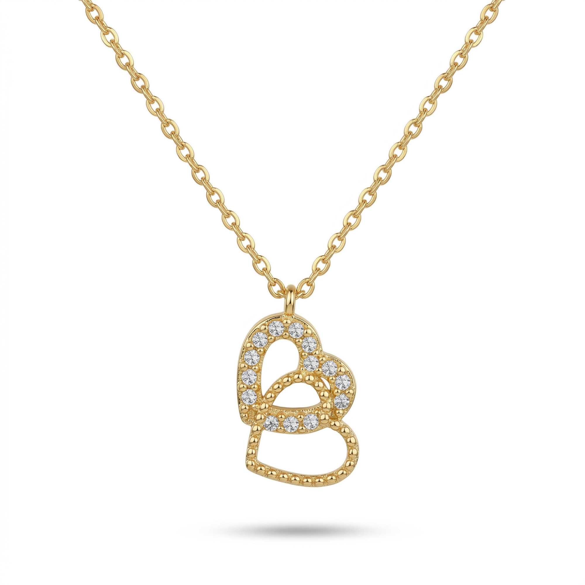 Collar de cadena fina con colgante de dos corazones entrelazados bañados en oro de 18K y detalles de cristales, marca Papelito, hecho en España.