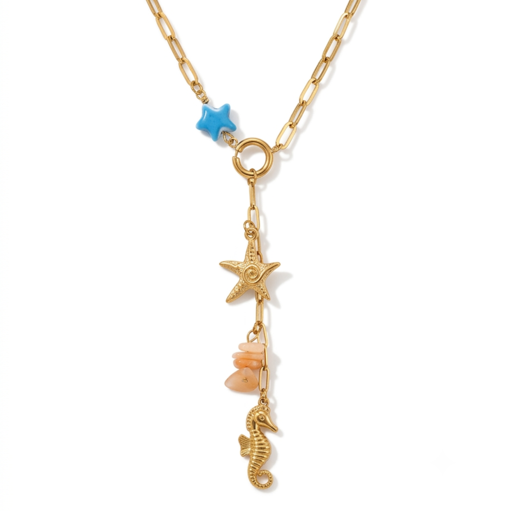 Collar de eslabones dorados de acero con diseño en Y, colgante de caballito de mar, estrella dorada, piedras en tono salmón y estrella azul, hecho en España.