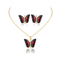 Conjunto Papillon Enchanté rojo: collar y pendientes de mariposa esmaltada en rojo con circonitas