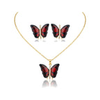 Conjunto Papillon Enchanté rojo: collar y pendientes de mariposa esmaltada en rojo con circonitas