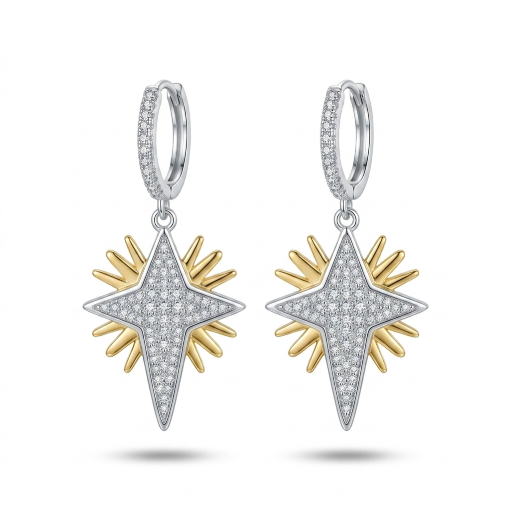 Pendientes colgantes de acero tipo aro con pavé de circonitas y dije de estrella polar bicolor, con rayos en oro de 18k y estrella brillante en oro blanco, hechos en España.