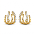 Pendientes de estilo multiaro o cuff con cuatro bandas en acero bañado en oro de 18K y circonitas pavé, fabricados en España.
