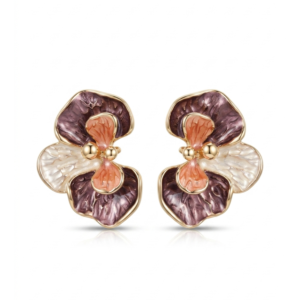 Pendientes de diseño botánico en forma de flor de orquídea con baño de oro de 18K y pétalos acrílicos texturizados en tonos borgoña, rosa y nácar, hechos en España.