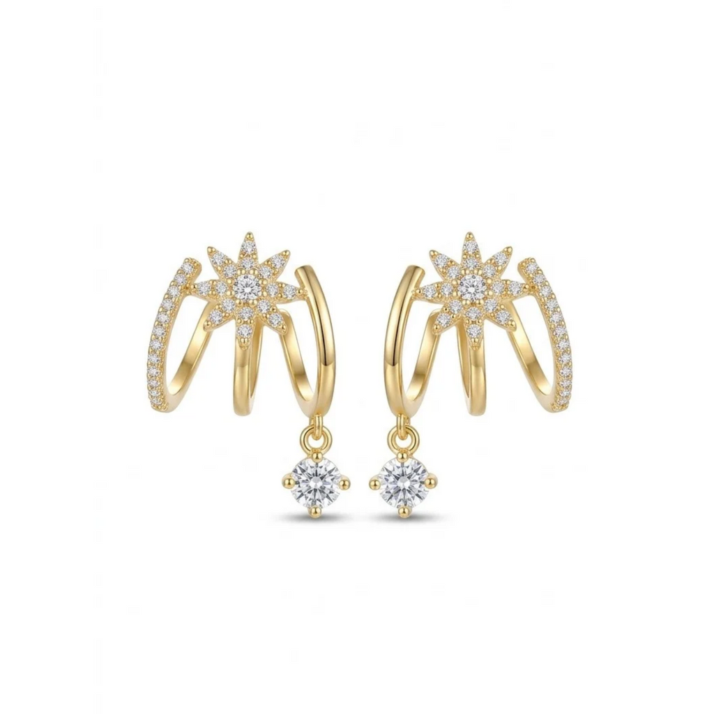 Pendientes dorados de triple arco con estrella polar de circonitas en pavé y cristal brillante colgante[cite: 18], con laminado en oro premium 18K PVD hecho en España.