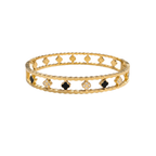 Pulsera rígida de acero inoxidable con baño de oro 18k, diseño calado con tréboles, circonitas y detalles negros hecha en España.