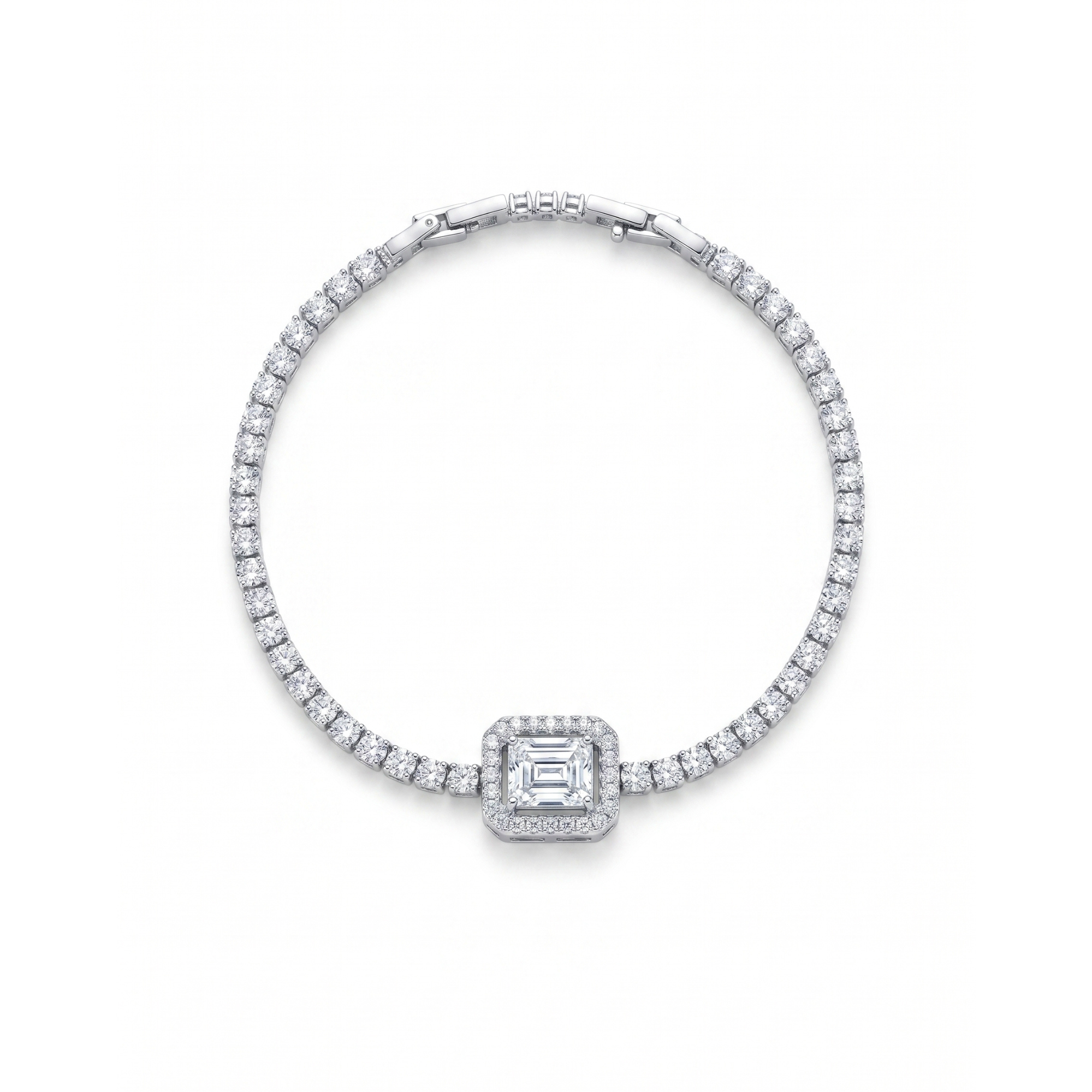 Pulsera estilo tenis en acero con baño de oro 18k PVD y piedra central corte esmeralda con halo de circonitas brillantes.