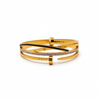 Bracelet rigide en acier plaqué or 18 carats, orné d'un clou, de zirconiums cubiques et d'émail noir.