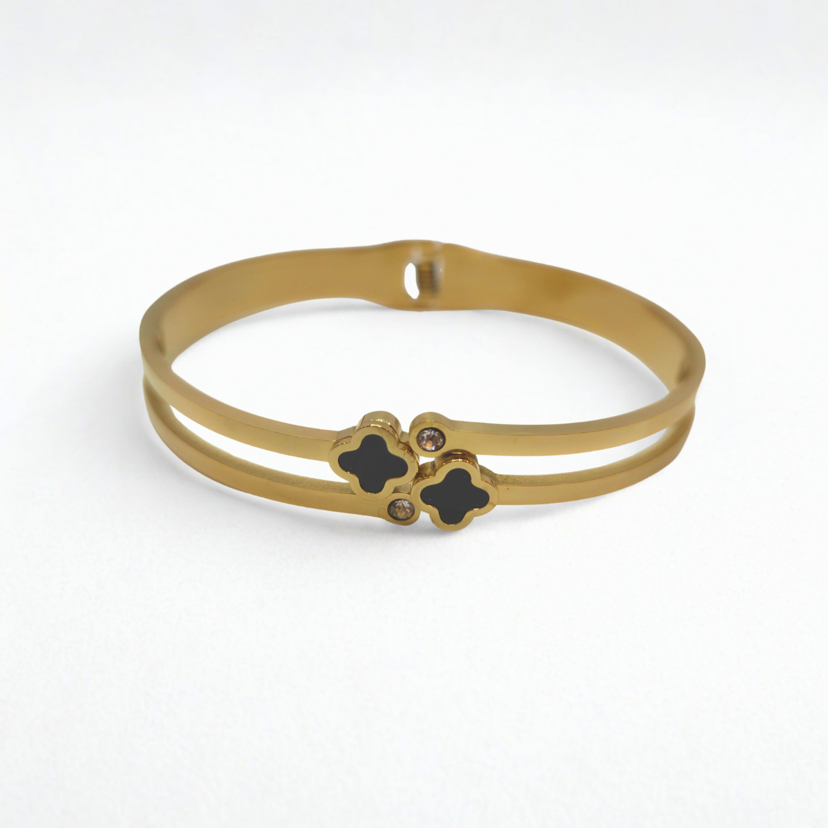 Bracelet rigide double bande avec trèfles émaillés noirs et zircones - 100 % acier plaqué or 18 carats