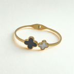 Pulsera Rígida con Doble Trébol: Nácar Blanco y Esmalte Negro - 100% Acero Bañado en Oro 18K