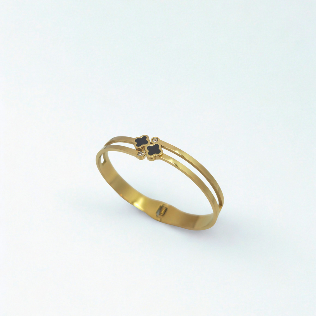 Bracelet rigide double bande avec trèfles émaillés noirs et zircones - 100 % acier plaqué or 18 carats