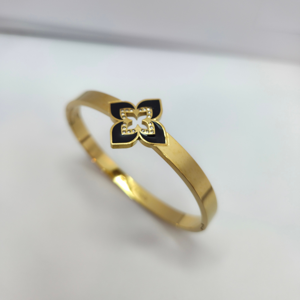 Bracelet rigide avec fleur émaillée à quatre pétales et zircone - 100 % acier plaqué or 18 carats