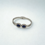 Pulsera Rígida con Dos Cristales Azules Ovalados y Circonitas - 100% Acero Bañado en Rodio