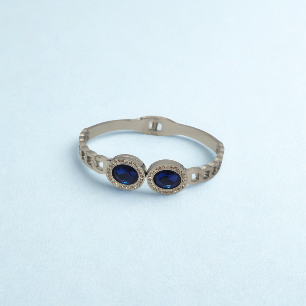 Bracelet rigide avec deux cristaux bleus ovales et zircones - 100 % acier rhodié