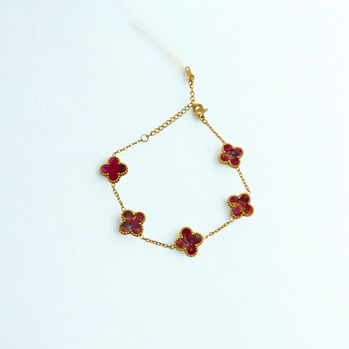 Pulsera de Trébol Tonalidad Vino con Oro 100% Acero Bañado en Oro 18K